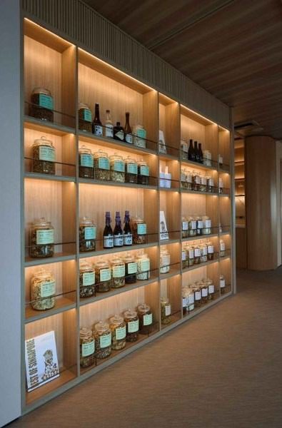 Backlit shelves accentuate the company’s products with a soft glow