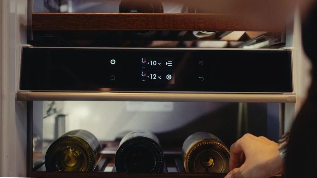 Photo 4 of 5 The WineCooler’s flexible beech wood shelves glide out for easy access to wines, while the timer-controlled lighting beautifully illuminates the interior—ideal for serving and showcasing one’s finest bottles