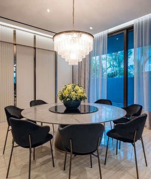 Photo 3 of 3 The grand dining table and chandelier